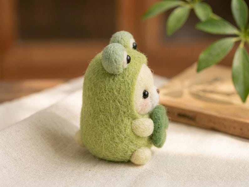Needle Felted Bear in Frog Costume, Handmade Wool Felt Animal Figurine, Green Frog Onesie with Shamrock